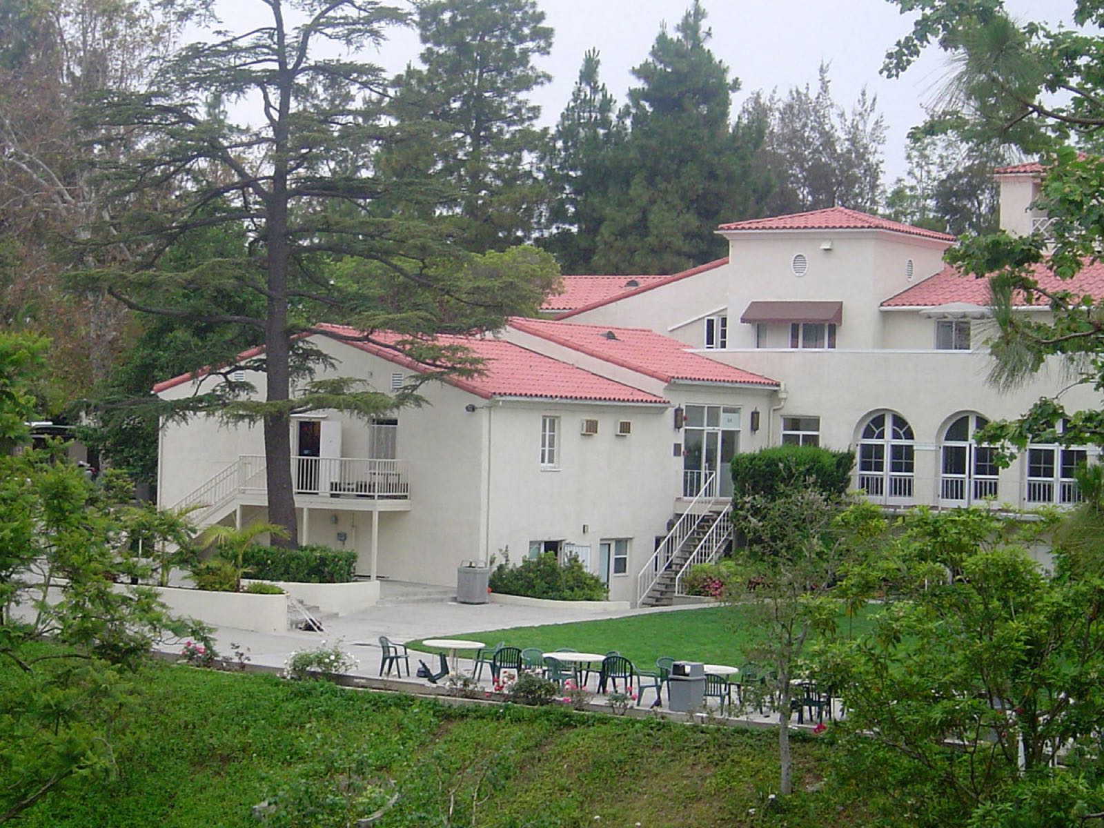White buildings with red tile roofs among trees on the Harvard-Westlake middle school campus